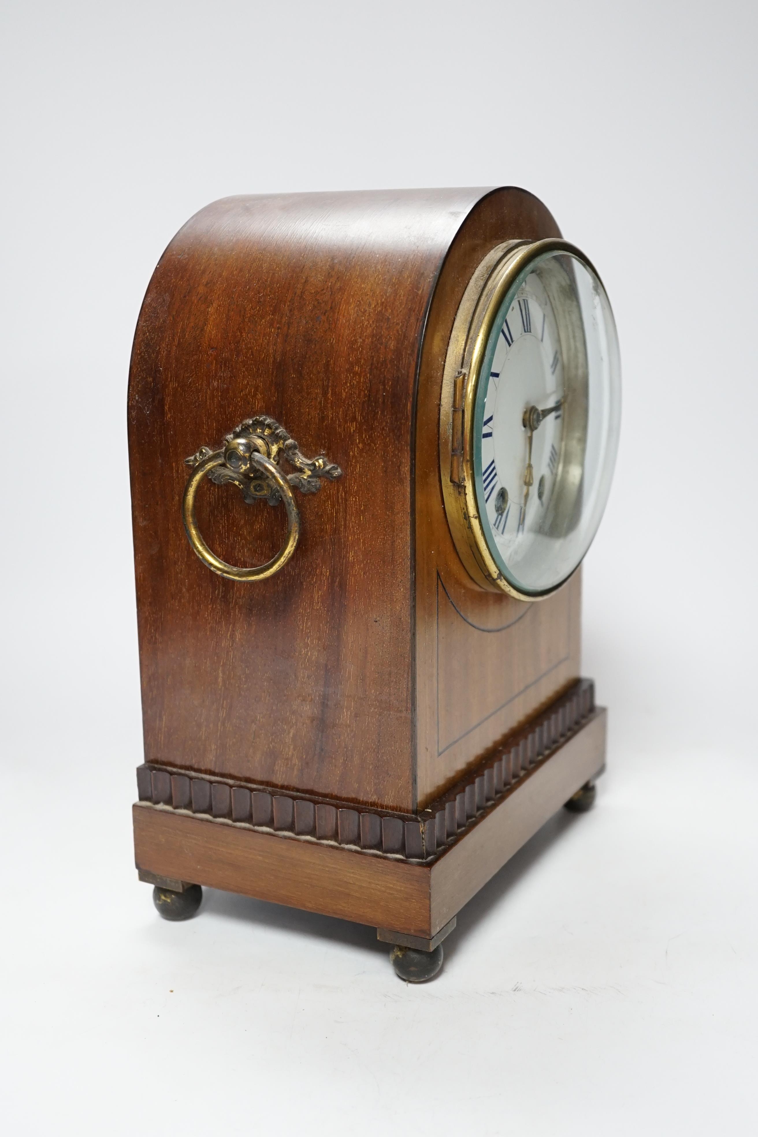 A late 19th century mahogany mantel clock with enamelled Roman numeral dial, 30cm high